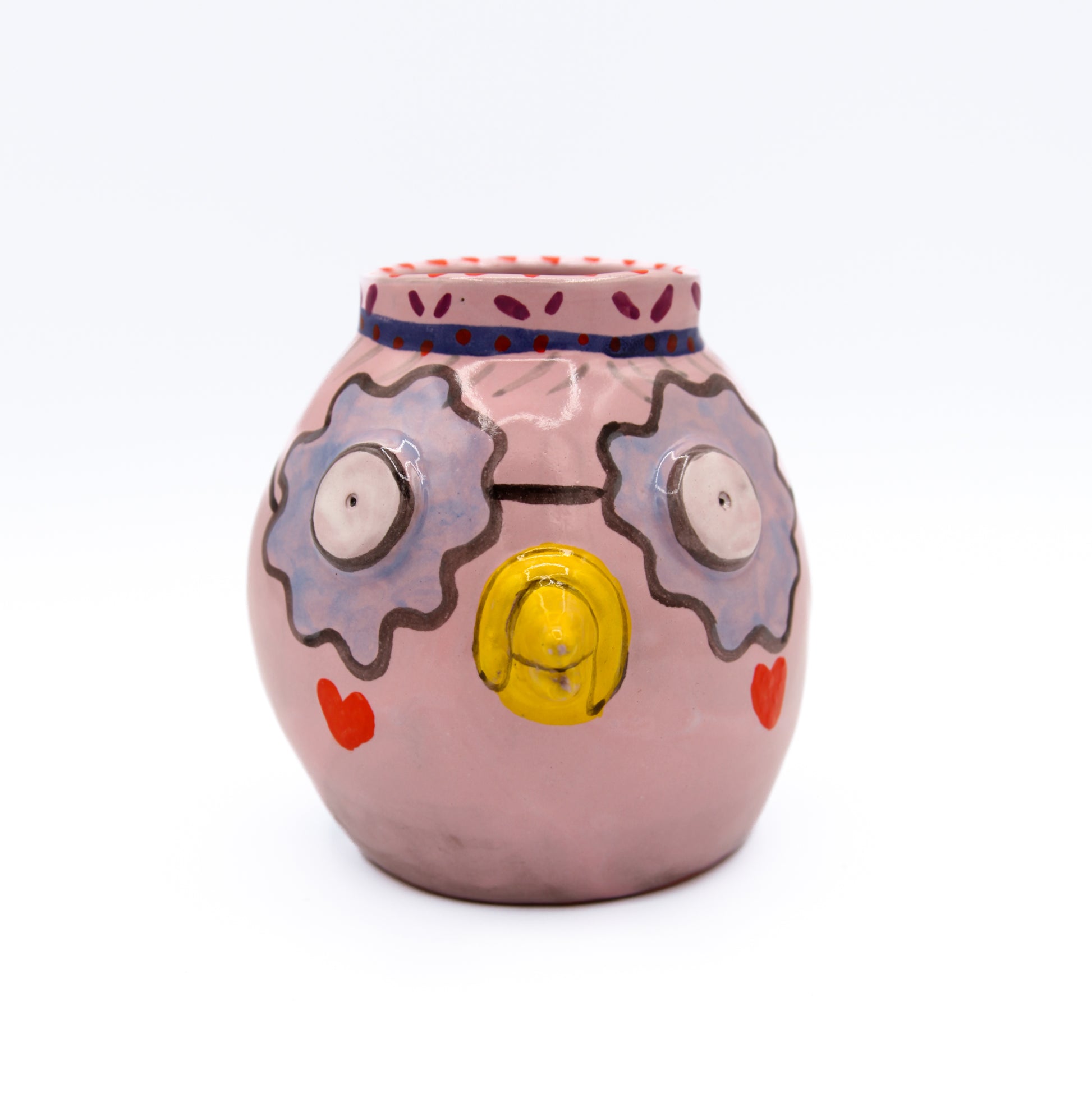 purple ceramic vase in the shape of a pigeon