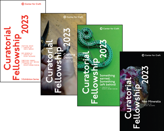 4 pack of paper catalogs that include information about the current exhibitions