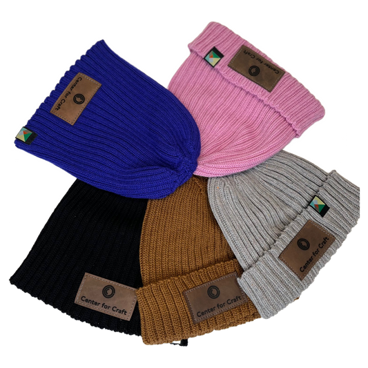Sustainably sourced wool and nylon woven beanie hats in various colors with a leather patch "Center for Craft" on the front 